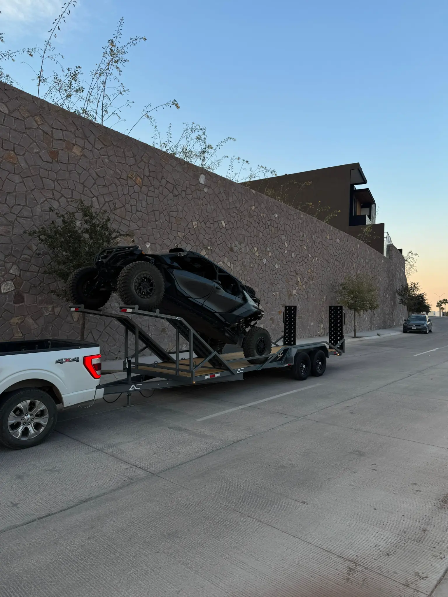 Custom tandem axle equipment trailer transporting off-road vehicle with elevated loading system - AC Solutions El Paso