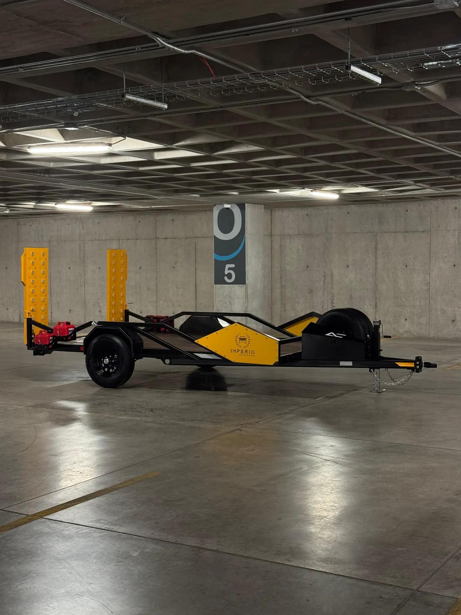 Custom yellow and black equipment trailer with imperial branding - AC Solutions custom fabrication